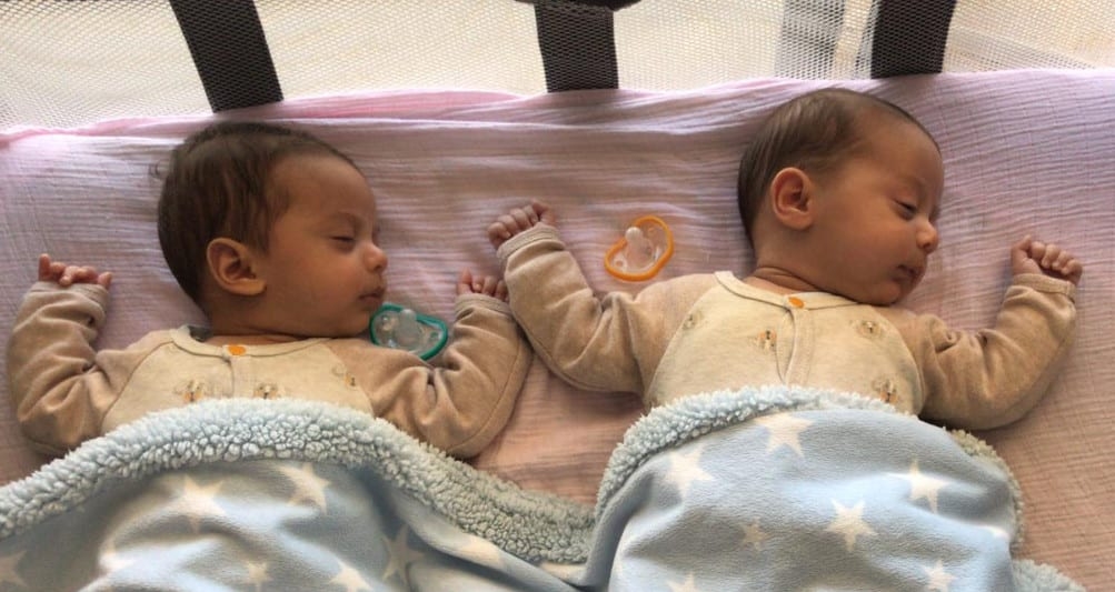 Nicoles twin babies sleeping with pacifiers