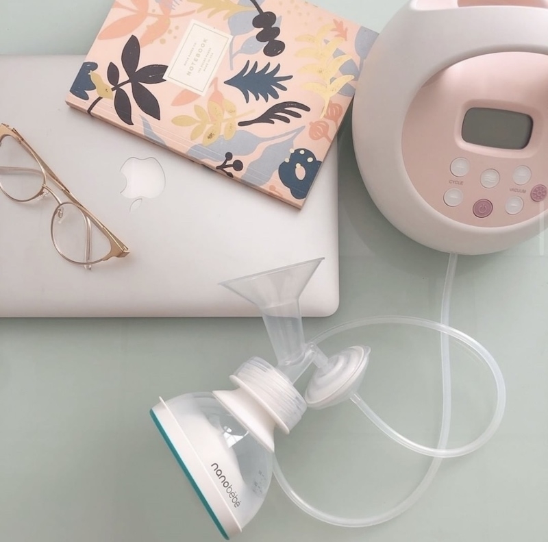 breast pump connected to breast milk bottle